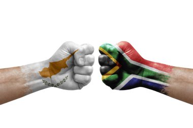 Two hands punch to each others on white background. Country flags painted fists, conflict crisis concept between cyprus and south africa