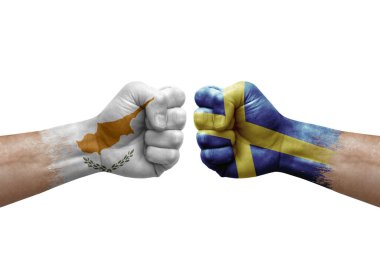 Two hands punch to each others on white background. Country flags painted fists, conflict crisis concept between cyprus and sweden
