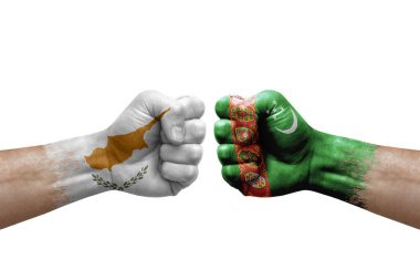 Two hands punch to each others on white background. Country flags painted fists, conflict crisis concept between cyprus and turkmenistan