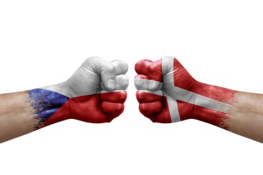 Two hands punch to each others on white background. Country flags painted fists, conflict crisis concept between czechia and denmark