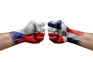 Two hands punch to each others on white background. Country flags painted fists, conflict crisis concept between czechia and dominican republic