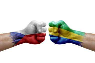 Two hands punch to each others on white background. Country flags painted fists, conflict crisis concept between czechia and gabon