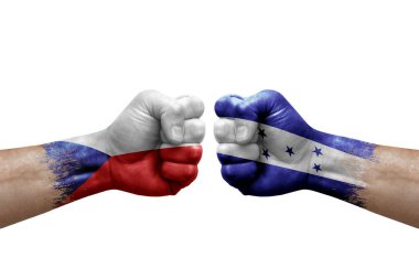 Two hands punch to each others on white background. Country flags painted fists, conflict crisis concept between czechia and honduras