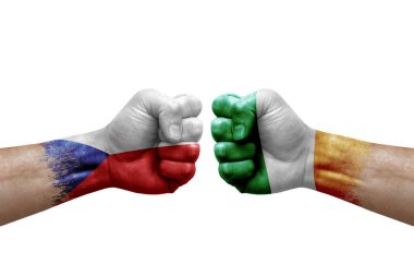 Two hands punch to each others on white background. Country flags painted fists, conflict crisis concept between czechia and ireland