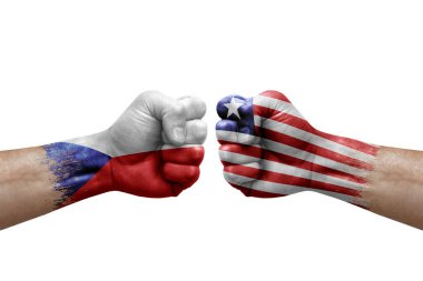 Two hands punch to each others on white background. Country flags painted fists, conflict crisis concept between czechia and liberia