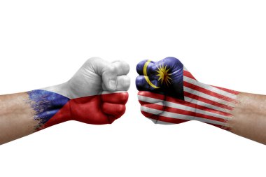 Two hands punch to each others on white background. Country flags painted fists, conflict crisis concept between czechia and malaysia