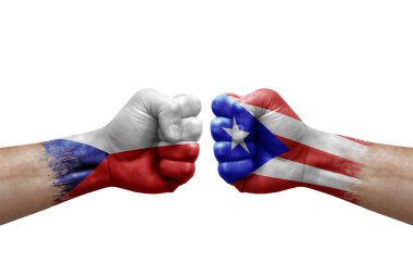 Two hands punch to each others on white background. Country flags painted fists, conflict crisis concept between czechia and puerto rico