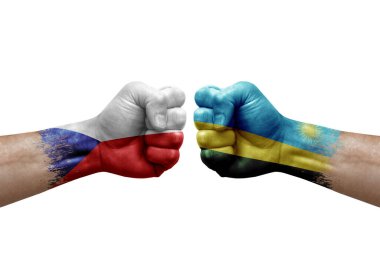 Two hands punch to each others on white background. Country flags painted fists, conflict crisis concept between czechia and rwanda