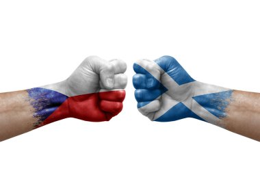 Two hands punch to each others on white background. Country flags painted fists, conflict crisis concept between czechia and scotland