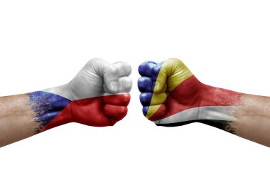 Two hands punch to each others on white background. Country flags painted fists, conflict crisis concept between czechia and seychelles
