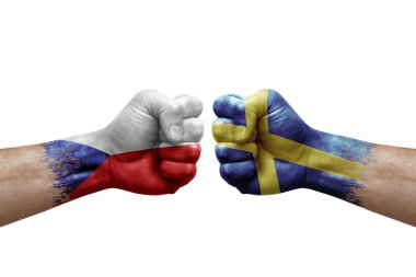 Two hands punch to each others on white background. Country flags painted fists, conflict crisis concept between czechia and sweden
