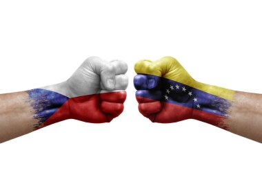 Two hands punch to each others on white background. Country flags painted fists, conflict crisis concept between czechia and venezuela