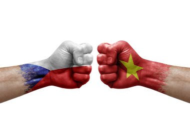 Two hands punch to each others on white background. Country flags painted fists, conflict crisis concept between czechia and vietnam