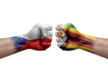 Two hands punch to each others on white background. Country flags painted fists, conflict crisis concept between czechia and zimbabwe