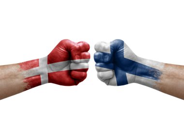 Two hands punch to each others on white background. Country flags painted fists, conflict crisis concept between denmark and finland