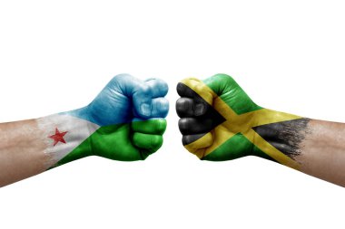 Two hands punch to each others on white background. Country flags painted fists, conflict crisis concept between djibouti and jamaica