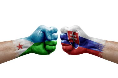 Two hands punch to each others on white background. Country flags painted fists, conflict crisis concept between djibouti and slovakia
