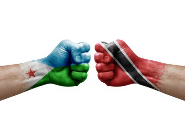Two hands punch to each others on white background. Country flags painted fists, conflict crisis concept between djibouti and tobago