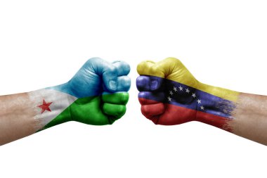 Two hands punch to each others on white background. Country flags painted fists, conflict crisis concept between djibouti and venezuela