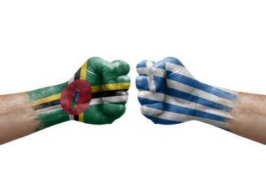 Two hands punch to each others on white background. Country flags painted fists, conflict crisis concept between dominica and greece