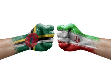 Two hands punch to each others on white background. Country flags painted fists, conflict crisis concept between dominica and iran