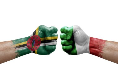 Two hands punch to each others on white background. Country flags painted fists, conflict crisis concept between dominica and italy