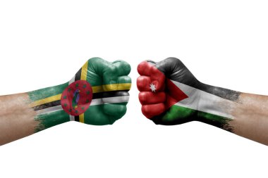 Two hands punch to each others on white background. Country flags painted fists, conflict crisis concept between dominica and jordan