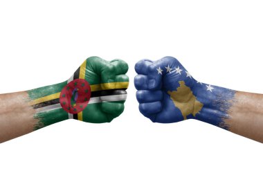Two hands punch to each others on white background. Country flags painted fists, conflict crisis concept between dominica and kosovo