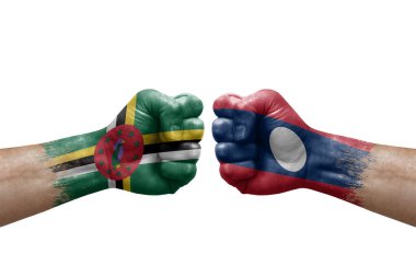 Two hands punch to each others on white background. Country flags painted fists, conflict crisis concept between dominica and laos