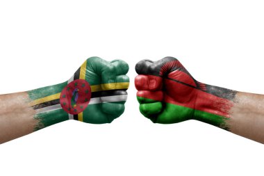 Two hands punch to each others on white background. Country flags painted fists, conflict crisis concept between dominica and malawi