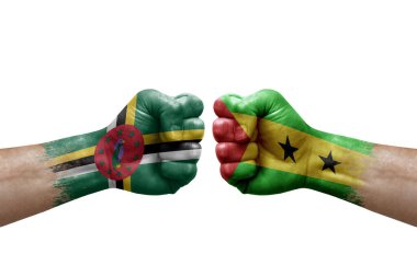 Two hands punch to each others on white background. Country flags painted fists, conflict crisis concept between dominica and sao tome and principe