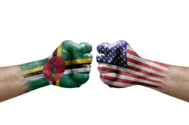 Two hands punch to each others on white background. Country flags painted fists, conflict crisis concept between dominica and usa