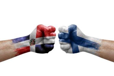 Two hands punch to each others on white background. Country flags painted fists, conflict crisis concept between dominican republic and finland