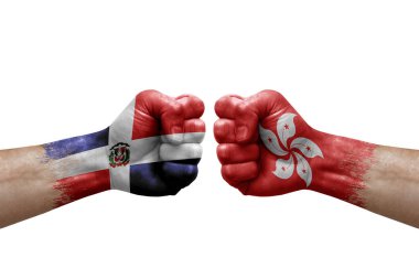 Two hands punch to each others on white background. Country flags painted fists, conflict crisis concept between dominican republic and hong kong