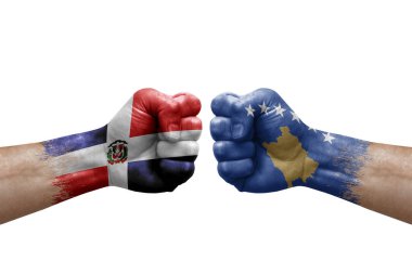 Two hands punch to each others on white background. Country flags painted fists, conflict crisis concept between dominican republic and kosovo