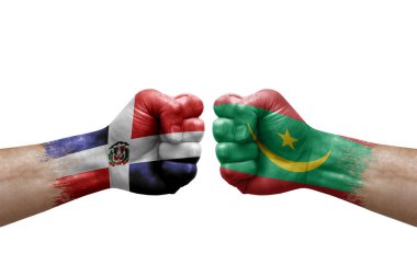 Two hands punch to each others on white background. Country flags painted fists, conflict crisis concept between dominican republic and mauritania