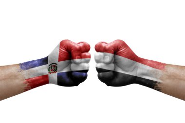Two hands punch to each others on white background. Country flags painted fists, conflict crisis concept between dominican republic and yemen