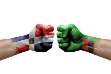 Two hands punch to each others on white background. Country flags painted fists, conflict crisis concept between dominican republic and zambia