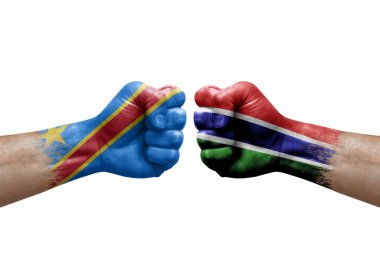 Two hands punch to each others on white background. Country flags painted fists, conflict crisis concept between dr congo and gambia