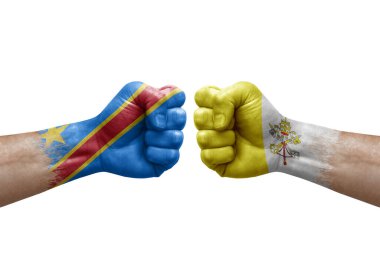 Two hands punch to each others on white background. Country flags painted fists, conflict crisis concept between dr congo and holy see