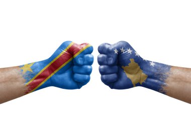Two hands punch to each others on white background. Country flags painted fists, conflict crisis concept between dr congo and kosovo
