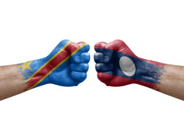 Two hands punch to each others on white background. Country flags painted fists, conflict crisis concept between dr congo and laos
