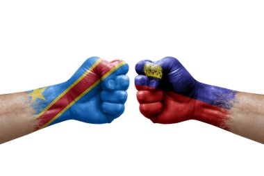 Two hands punch to each others on white background. Country flags painted fists, conflict crisis concept between dr congo and liechtenstein