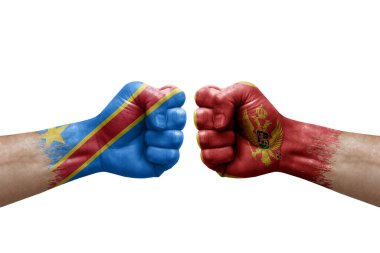 Two hands punch to each others on white background. Country flags painted fists, conflict crisis concept between dr congo and montenegro