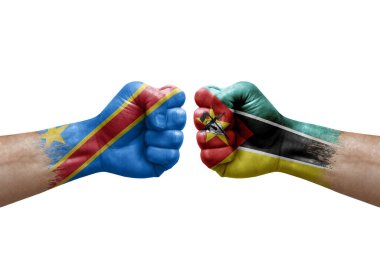 Two hands punch to each others on white background. Country flags painted fists, conflict crisis concept between dr congo and mozambique