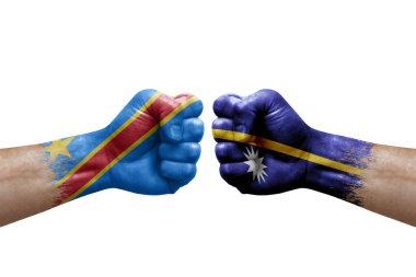 Two hands punch to each others on white background. Country flags painted fists, conflict crisis concept between dr congo and nauru