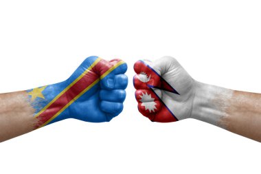 Two hands punch to each others on white background. Country flags painted fists, conflict crisis concept between dr congo and nepal