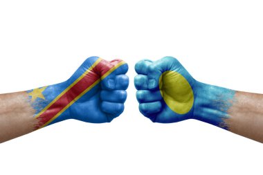 Two hands punch to each others on white background. Country flags painted fists, conflict crisis concept between dr congo and palau