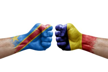Two hands punch to each others on white background. Country flags painted fists, conflict crisis concept between dr congo and romania