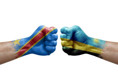 Two hands punch to each others on white background. Country flags painted fists, conflict crisis concept between dr congo and rwanda